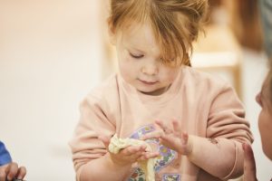 Toddler exploring her sense of touch